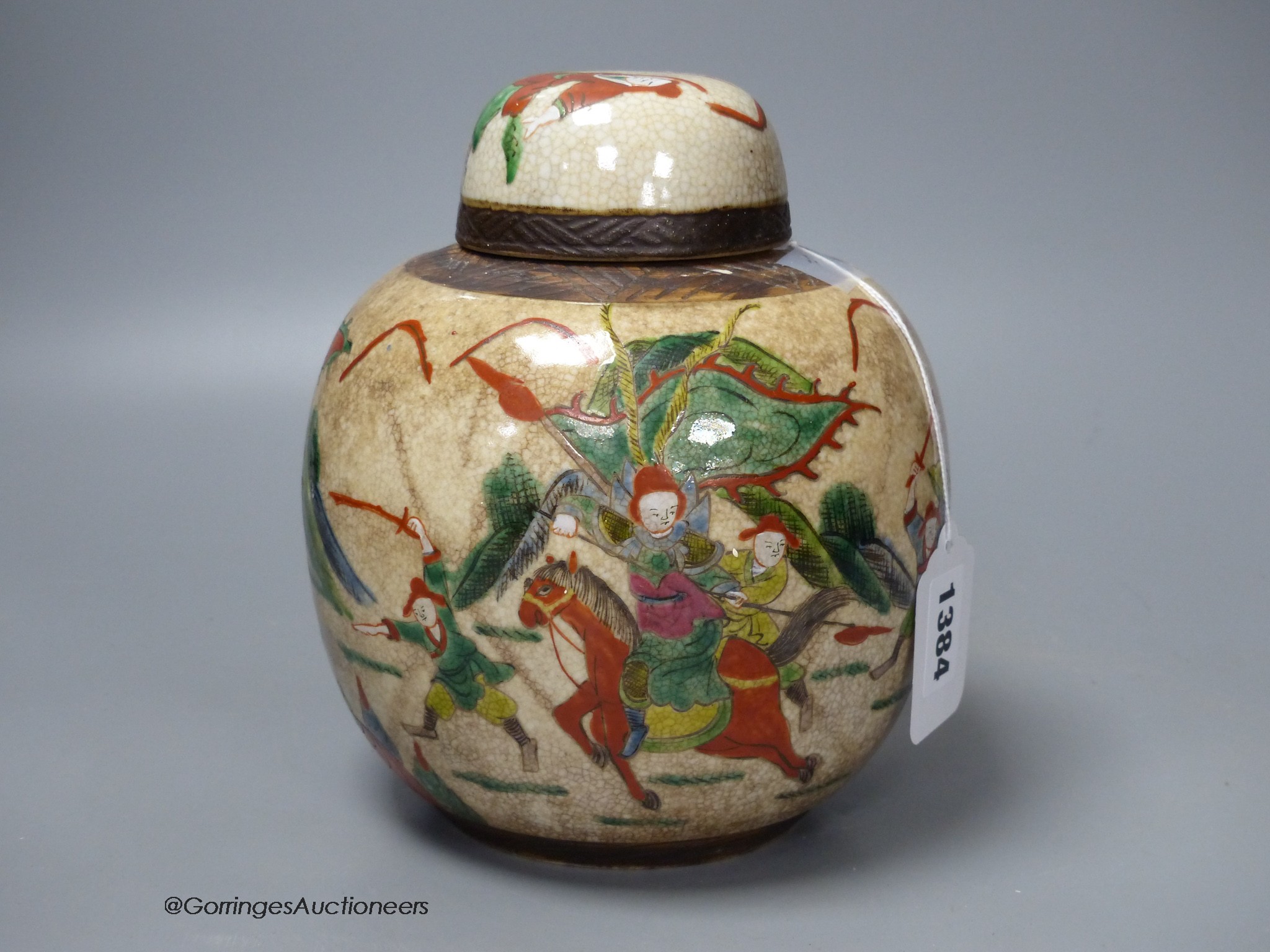 An early 20th century Chinese famille rose crackle glaze jar and cover, 20cm high